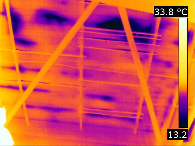 Thermal image showing damp roof insulation inside a commercial building